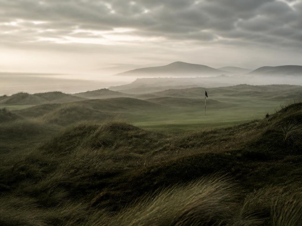 A coastal links golf course in the early morning